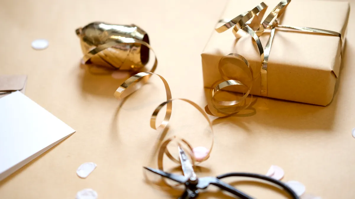How to wrap a present without tape gift wrapping supplies beside a wrapped present